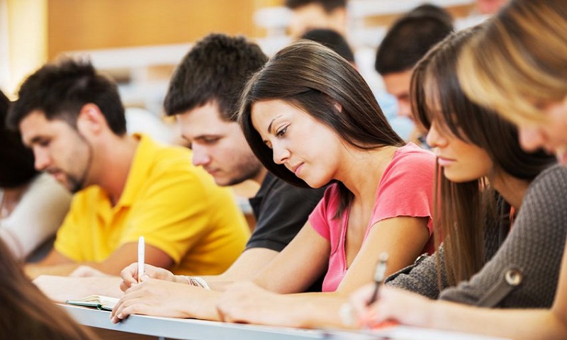 Students writing in a lecture