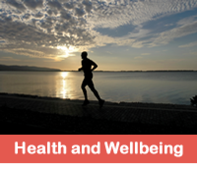 Health and Wellbeing - runner running across beach