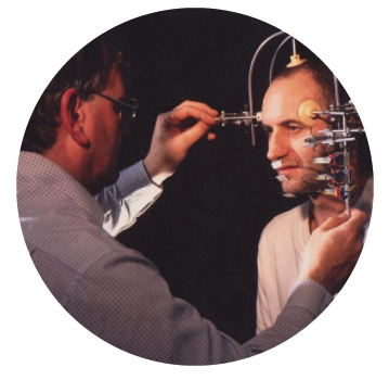 Man fixing medical monitoring equipment to a mans face