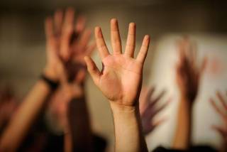 Image of raised hands
