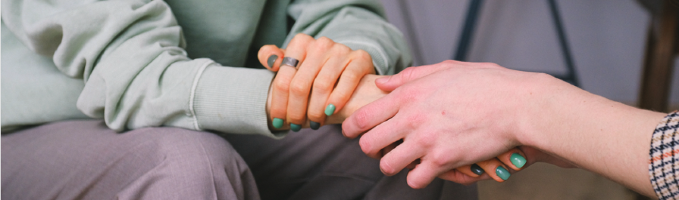 image of two holding hands