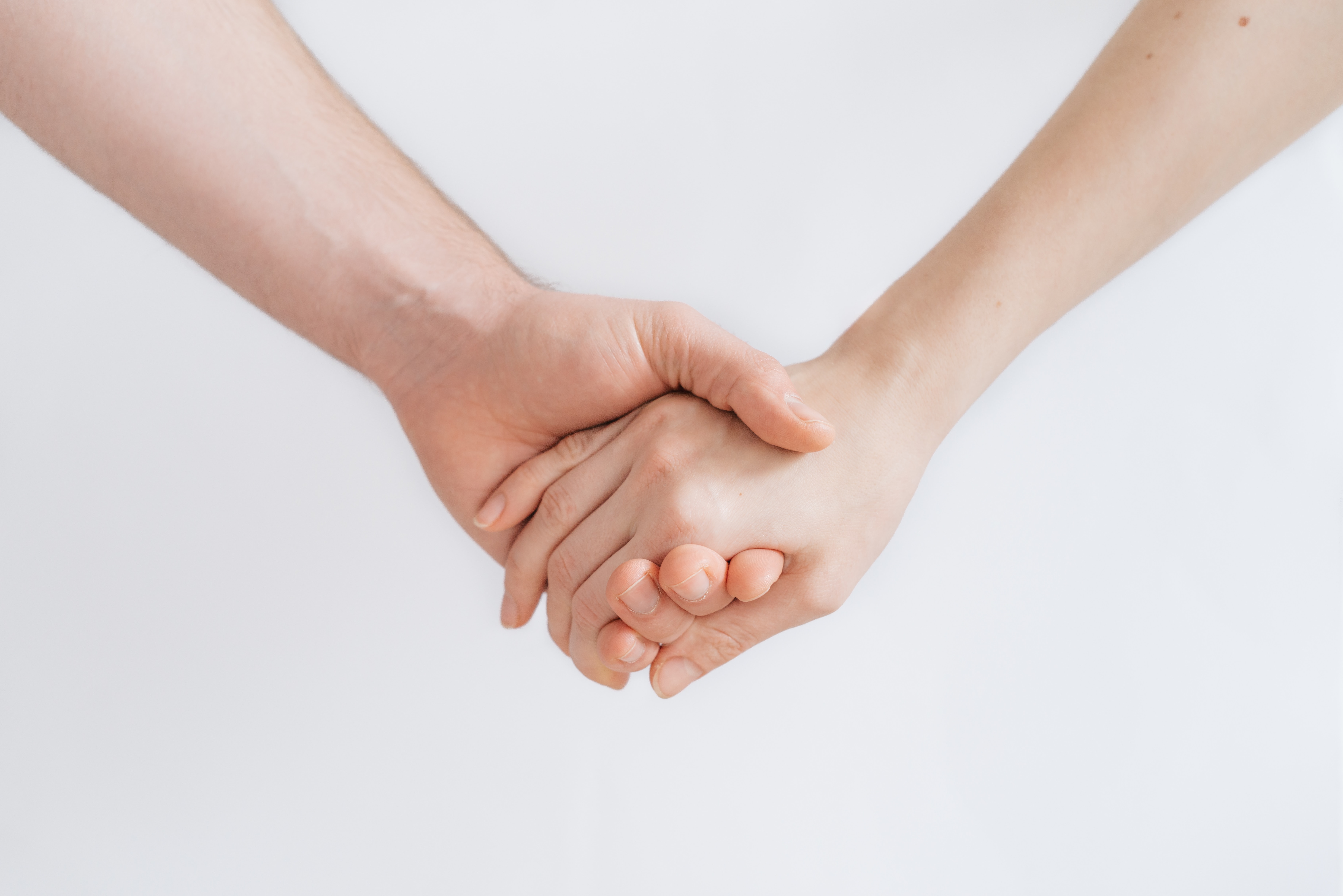Two hands holding on a white background