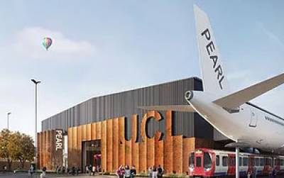 An aircraft with PEARL written on the tail outside of a building with UCL on it