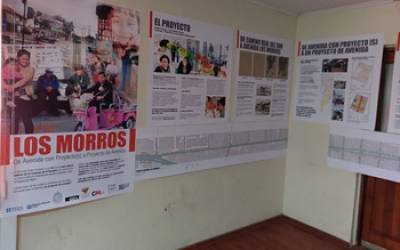 A hallway filled with posters giving information on "Los Morros"