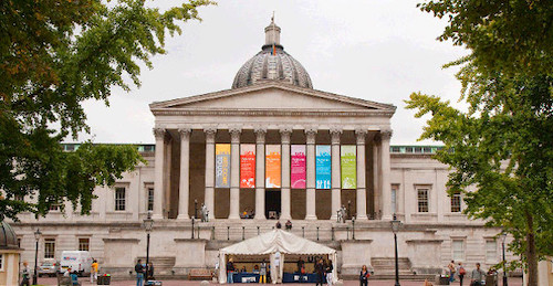 UCL front portico with coloured banners between the columns, two trees either side and a white marquee in the foreground