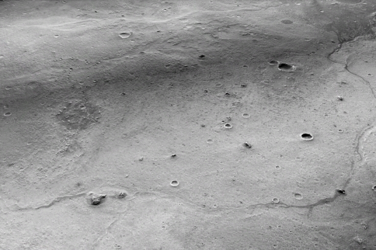 Greyscale image of the surface of Mars - credit: NASA/JPL/MSSS/Peter Grindrod