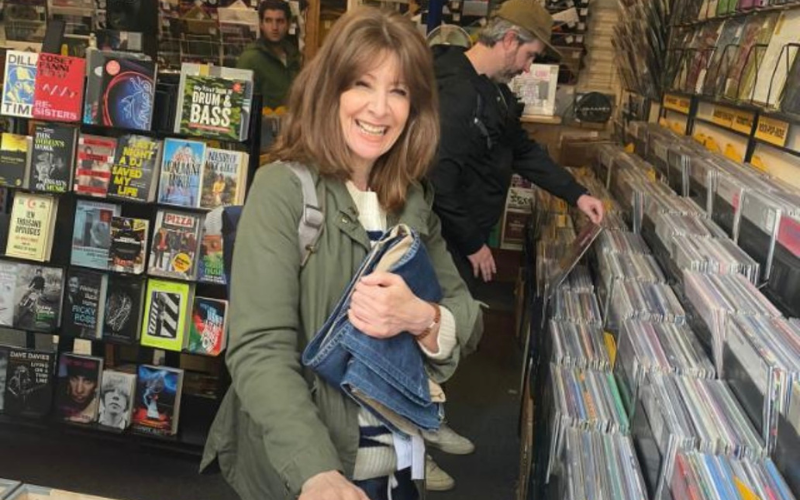 Helen browses records in a vinyl and second hand shop
