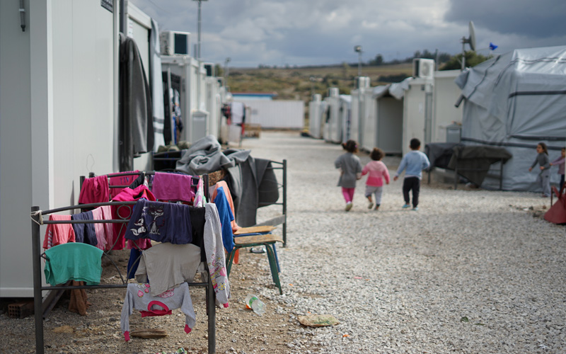 Refugee camp with children walking