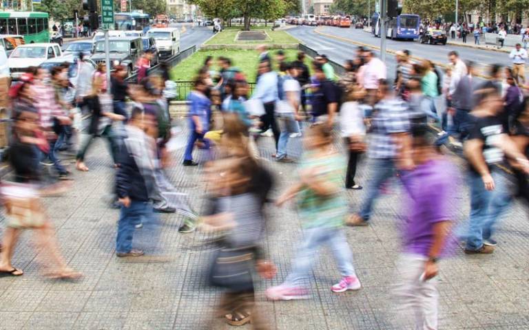 Blurred photo of people crossing road