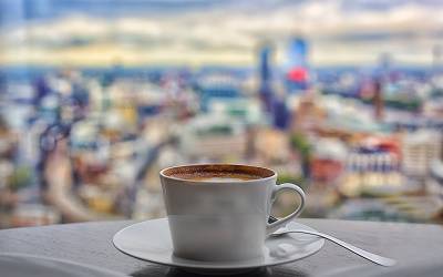 A cup of coffee on a table on a London balcony.