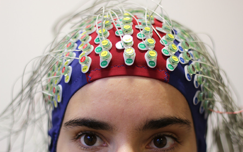 Study participant wearing UCL ear institute EEG skullcap.