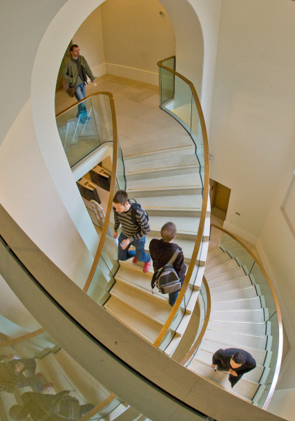 Students using staircase in UCL campus building.