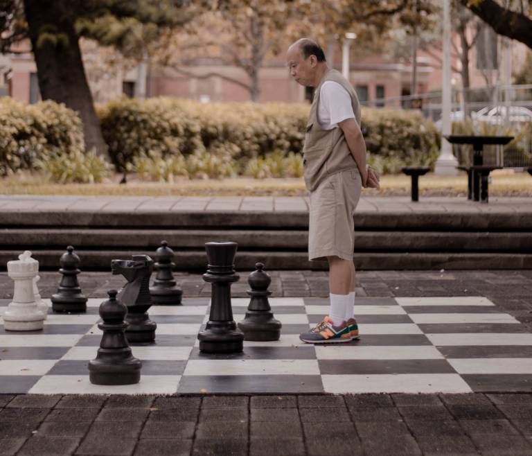 man playing large chess