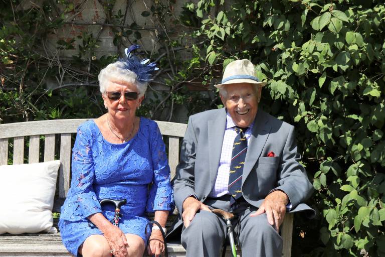 Older couple sitting in bench