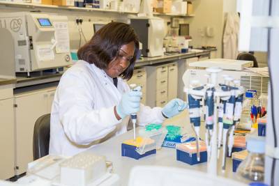 Female Scientist working at lab bench
