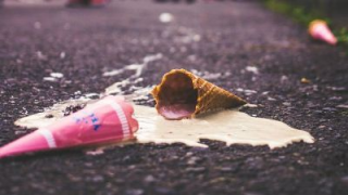 Ice cream cone fallen on pavement