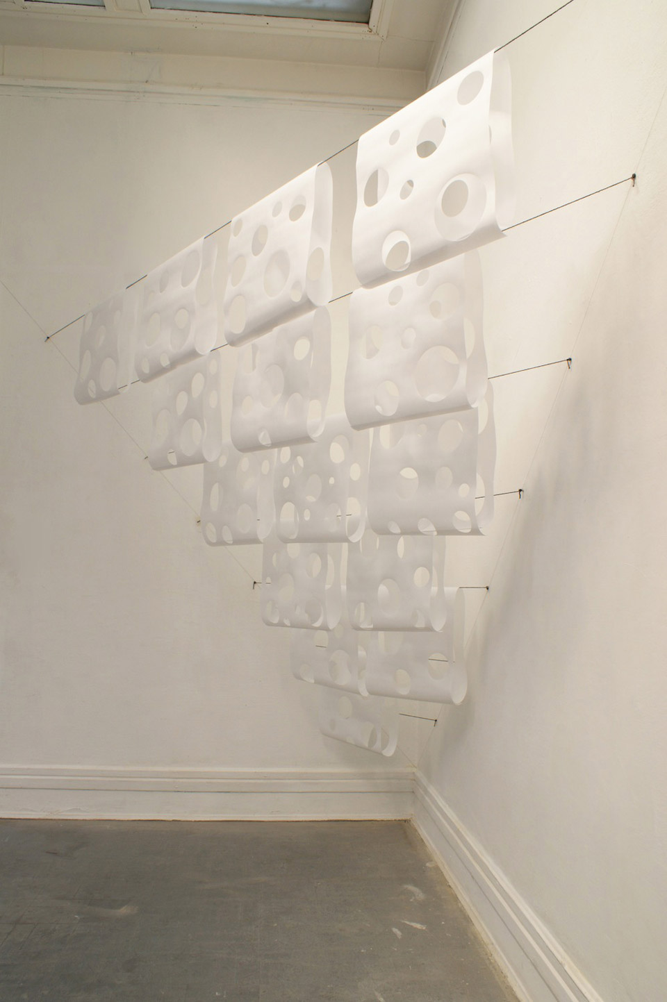 Untitled, 2012, Japanese paper hung on strings, paper sizes: 100 x 46 cm, total dimensions: 300 x 300 x 150 cm
