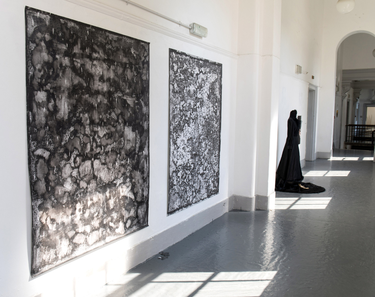 Installation photo, MA/MFA/PhD Degree Show 2023, foreground paintings by Camilo Parra and behind sculpture by  Kasia Garapich/Katarzyna Depta-Garapich
