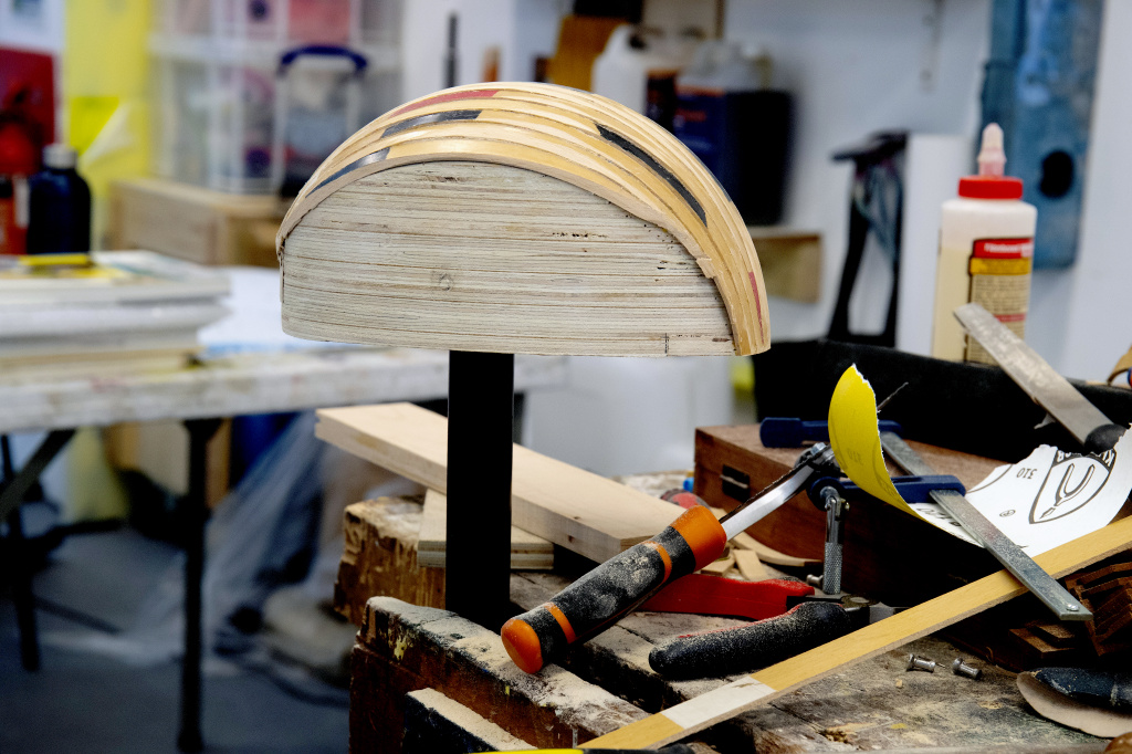 Wood workshop, wooden sculpture in progress and tools