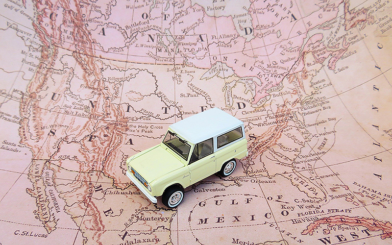 Map of North America with toy car