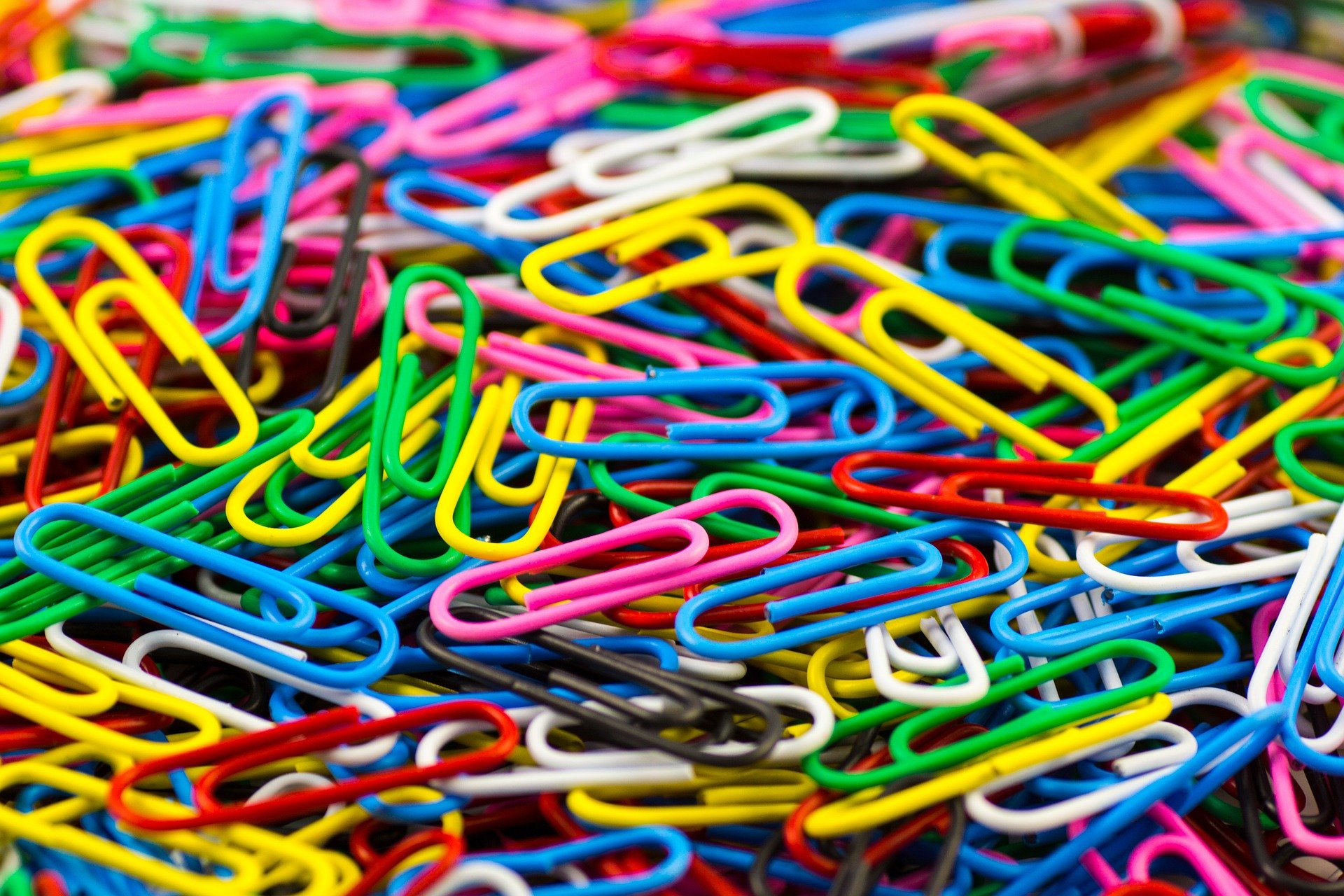 Pile of coloured paperclips.