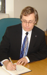 Dr Tõnis Lukas signs the Visitor's Book during his visit to SSEES…
