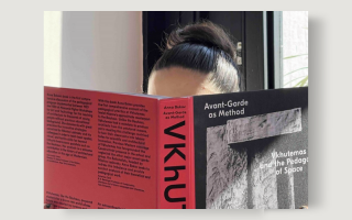 A person reading the book Avant Garde as Method