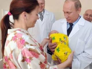 Putin holding a baby