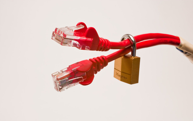 Red cables with padlock around