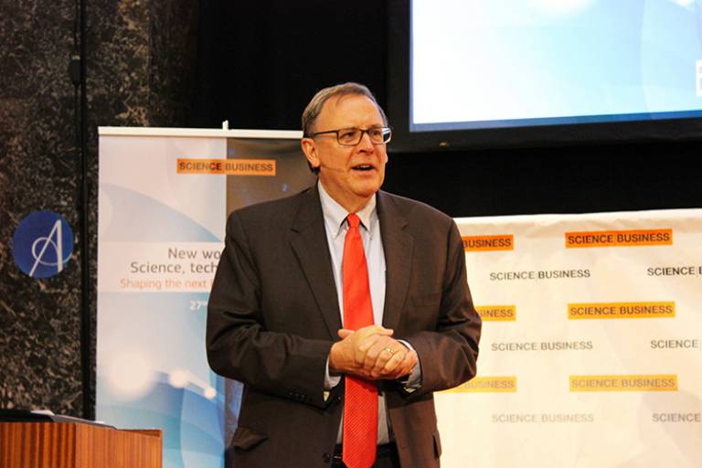 An image of Richard Hudson presenting at an event