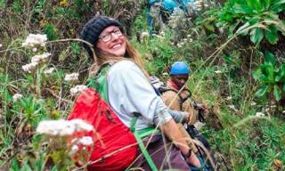 Photo of PhD Sarah Bebb climbing hill