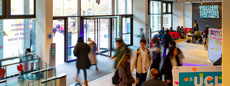 Foyer of the UCL student centre with students walking through the entrance.