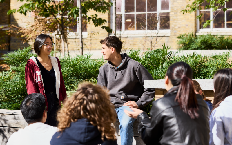Students talking to each other in the main quad.