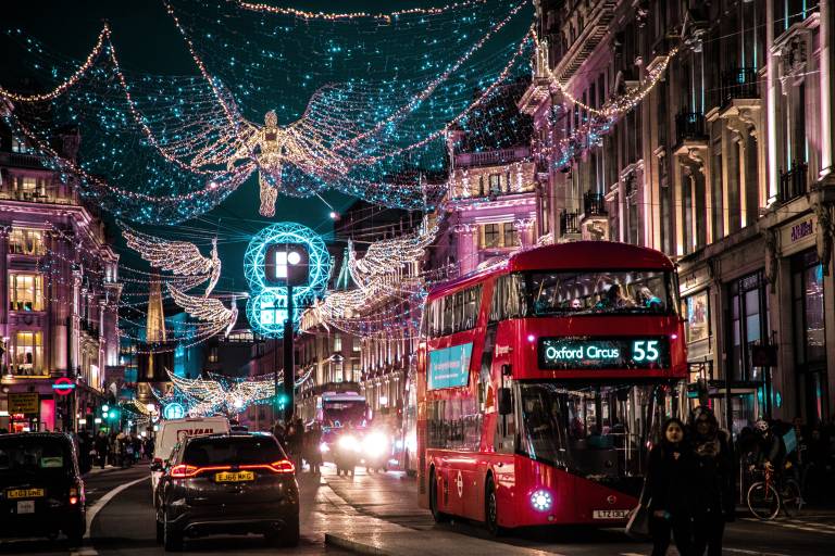Night on Oxford Street in London with bus and Christmas lights