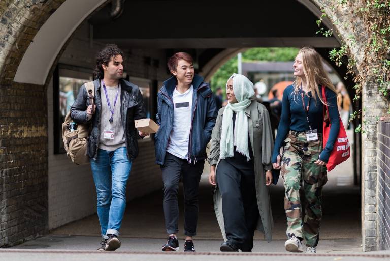 Four UCL students walking on campus near Malet Place
