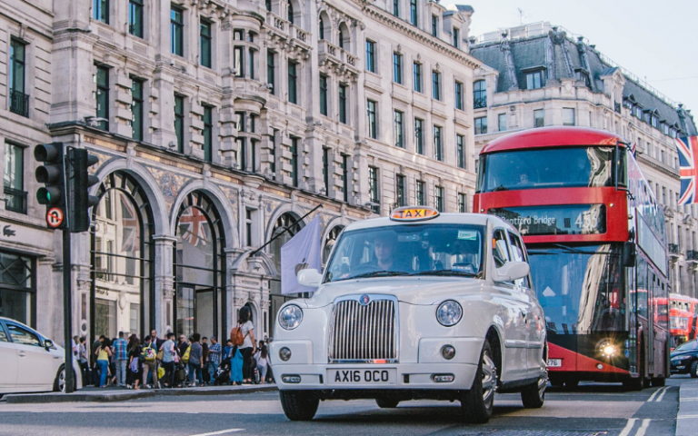 London taxi and bus on the street