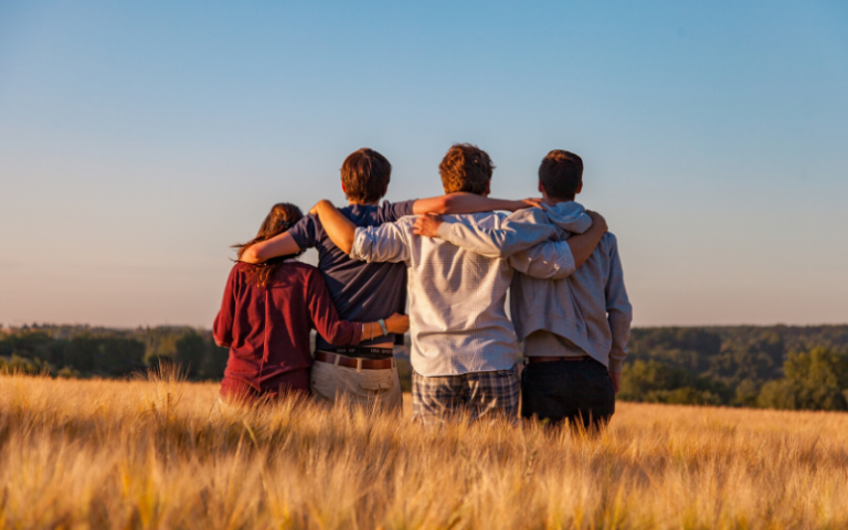 Four friends in a field