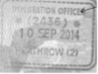 Black and white image of entry clearance stamp in passport