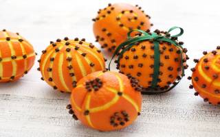 pomanders are oranges decorated with cloves and ribbon