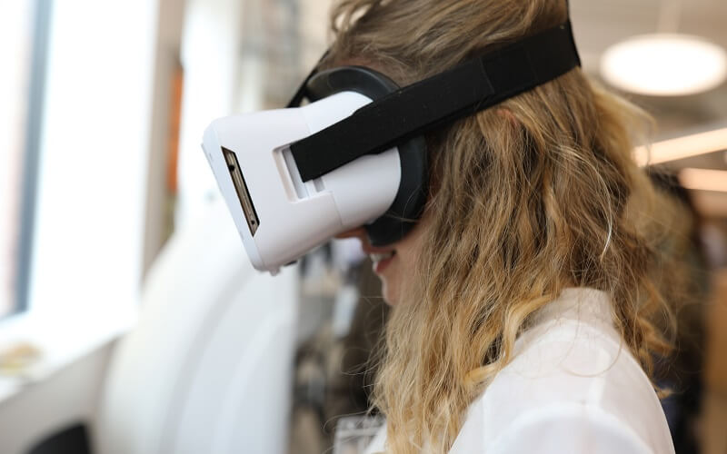Female medic uses VR headset