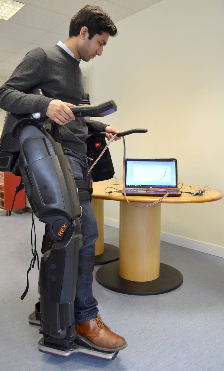 Research student tests robotic exoeskleton device. 