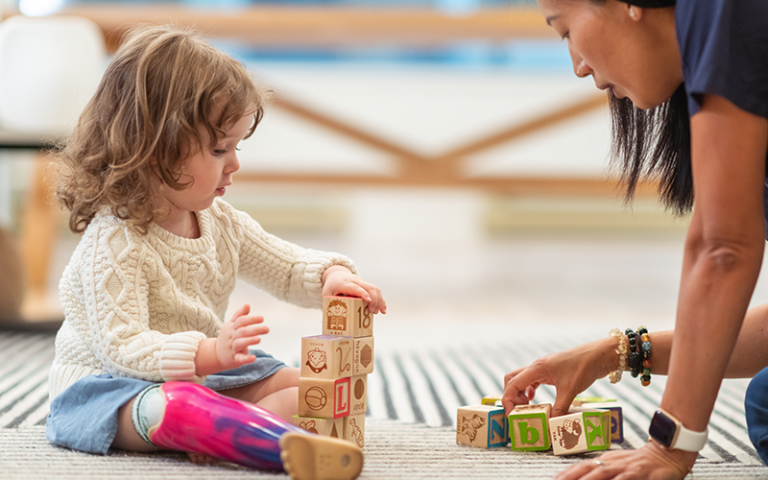 An image of a child playing with blocks