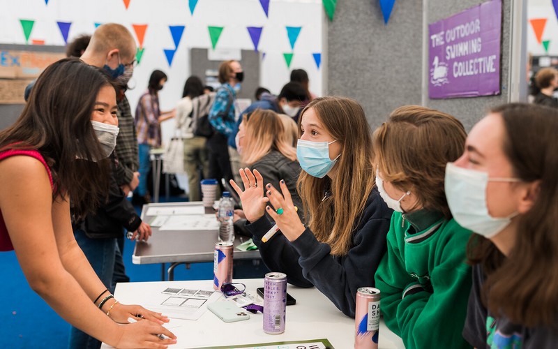 Students chatting at a stall during the Sustainability Fair 2021