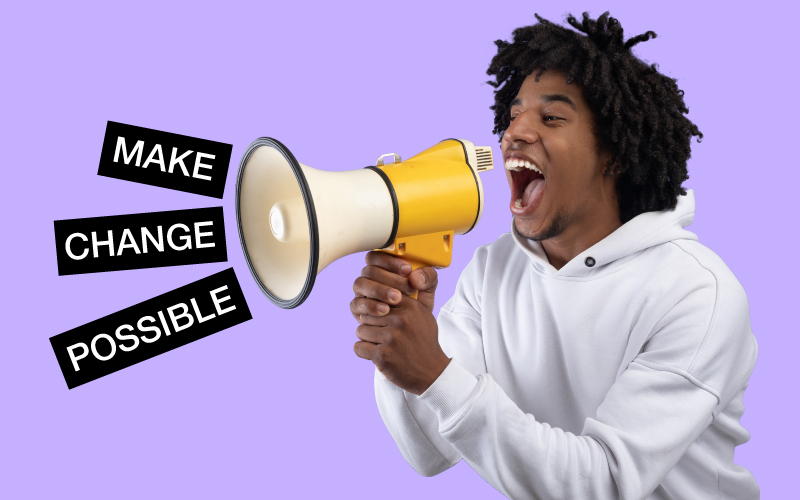Image of man talking through a microphone with the words 'Make Change Possible'