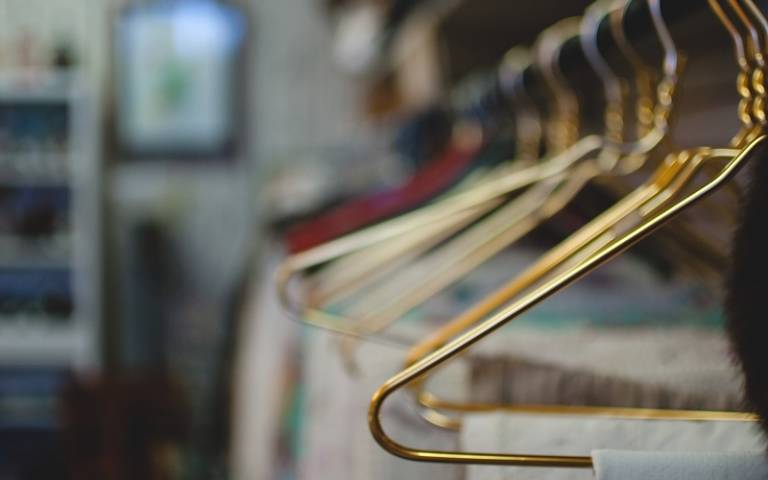 Clothes on a hanger, Caleb Lucas on Unsplash