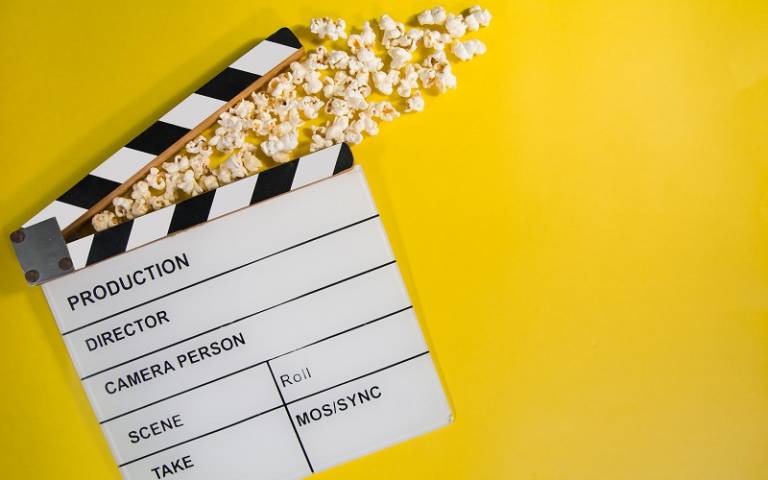 popcorn and a movie making prop Photo by GR Stocks on Unsplash