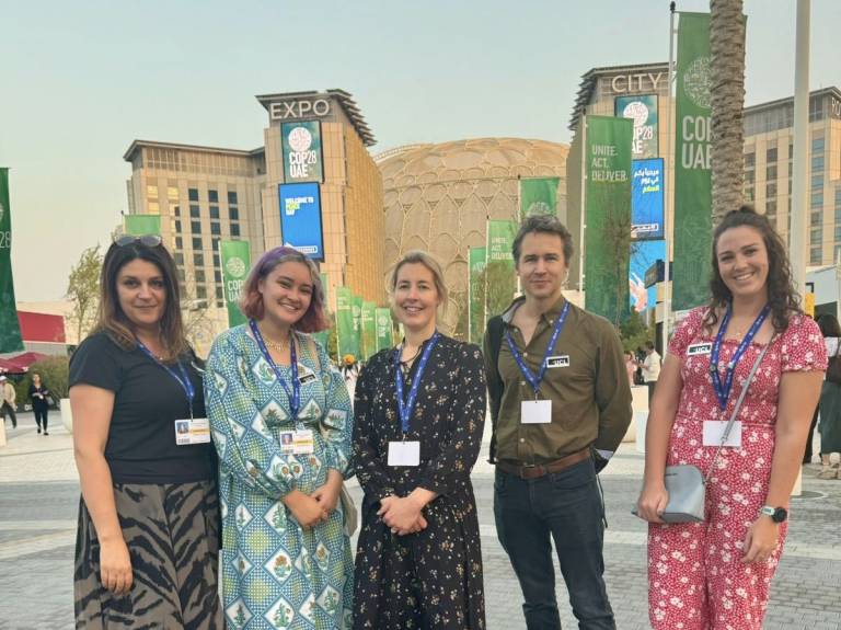 COP28 team standing in front of Expo city dubai
