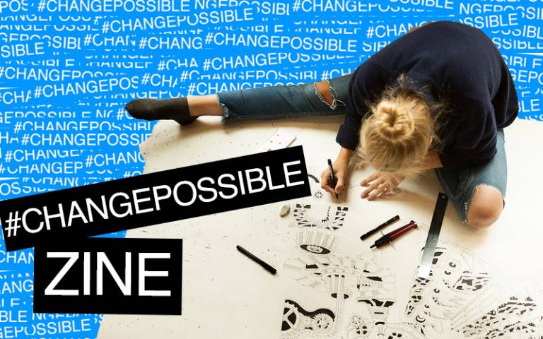 Girl drawing on the floor with the title #ChangePossible Zine as stickers on top