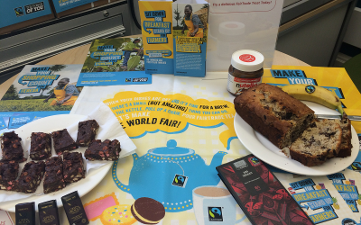 Photo of a Fairtrade Display with cakes, promotional materials and chocolate