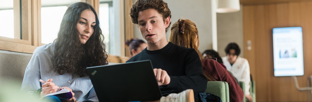 Two students with a laptop 
